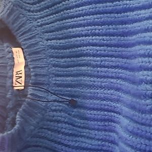 Navy blue with royal blue sweater that is mid waist, loose fit, never worn